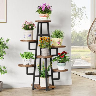 Raised your lively plants in a higher place and settled them in your corner, making them attractive and eye-catching in your home. Tiered plant stand in simple and natural design is suitable for all kinds of small spaces, placed in your bedroom, living room, corridor, sofa corner, hallway, garden, or patio, and turns your boring small space into a vibrant and elegant scenery. Color: Rustic Brown | 17 Stories Mayetta Rectangular Multi-tiered Plant Stand Wood / Metal / Manufactured Wood in Brown, Multiple Plant Stand Indoor, Outside Plant Stands, Planter Stand Ideas, Creative Plant Stands, Tiered Plant Stand Indoor, Shelf Designs, Plant Display Ideas, Tattoo Plant, Indoor Plant Wall