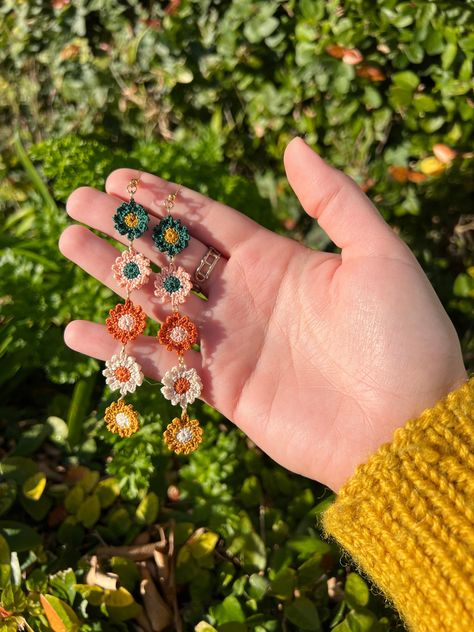 Handmade micro crochet flower chains, daisy chains, crochet drop earrings, hypoallergenic silver, gift These earrings are handcrafted with a 0.6mm crochet hook and Gütermann's sewing thread. The finished earring is around 9cm x 1.5cm, making these light and easy to wear all day long. The bright colours will bring a pop of life to any outfit. A great gift for a special someone! **New ear wires** I have changed supplier for jewellery, so the design is slightly different. See listing images for the updated earrings hooks! These items are made to order, so please allow a couple of days before they are able to be shipped. Crochet Flower Chain, Micro Crochet Flower, Daisy Chains, Strawberry Necklace, Micro Crochet, Flower Chain, Light Earrings, Sterling Silver Jewellery, Daisy Chain