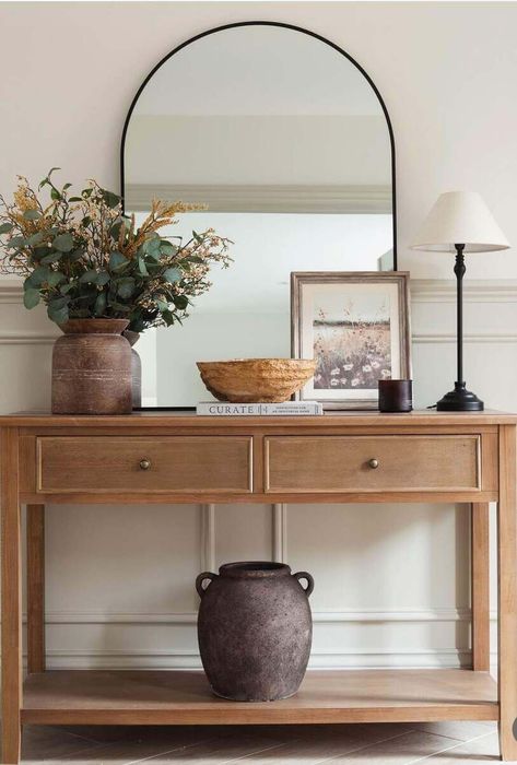 26 Stylish Console Table Decor Ideas to Transform Your Entryway Entry Table Organic Modern, Entryway Table With Arch Mirror, 1st Home Decor Ideas, Console Table Front Door, Candle Stick Entry Table, Entry Console Table Styling, Leaning Mirror On Console Table, Den Entryway Ideas, Apartment Small Entryway Ideas
