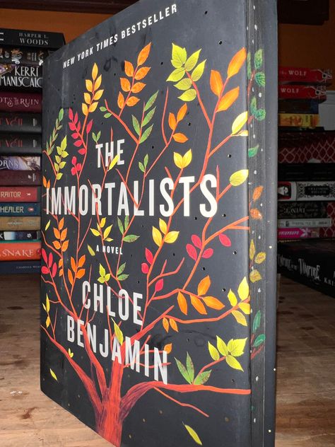 Hardcover copy of Chloe Benjamin's The Immortalists.  Edge is painted with continuation of book jacket design.top and bottom edge are painted black Books, Westminster, Book Jacket Design, The Immortalists, Book Jacket, Jacket Design, Music Book, Chloe, Literature