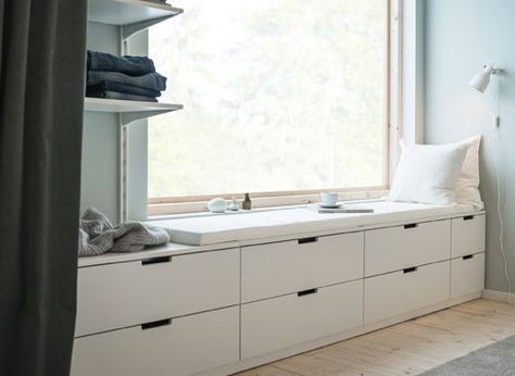 A wall with a window and a row of low bedroom storage made from modern, white chests of drawers Bedroom Window Seat, Diy Mattress, Soothing Bedroom, Design Ložnic, Bedroom Storage Chest, Ikea Drawers, Peaceful Bedroom, White Chest Of Drawers, Modern Chest Of Drawers