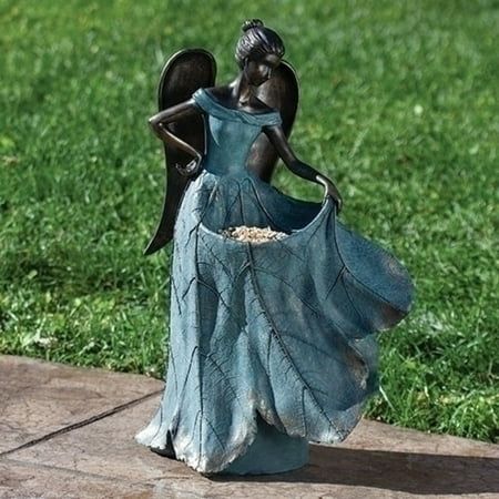 This beautifully crafted birdbath with angel statue would complement any indoor or outdoor setting. For years to come, observe the charm it exudes. Place this fine work of art in a well-chosen location in your living room or patio to breathe new life into it. Product Features: Blue angle with leaf dress and birdbath outdoor statue. A thoughtful gift to your loved ones. Perfect for living rooms, patios, and garden sanctuaries alike. Recommended for both indoor and outdoor use. Dimensions: 20"H x 13.5"W x 8.5"D. Material(s): resin/stone mix Dress Bird, Leaf Dress, Garden Fairies Figurines, Outdoor Garden Statues, Angel Statue, Flamingo Decor, Faux Flower Arrangements, Angel Statues, Fairy Figurines