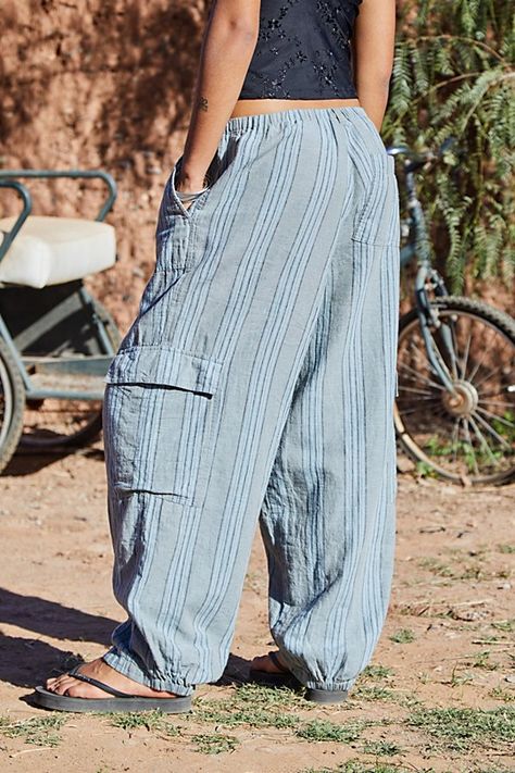 Softest cocoon cargo pants by BDG, a woven linen-blend pair with multi-pockets throughout. Features a low-rise waist that's fastened by a drawstring waistband, side pockets and a relaxed leg. Topped with vertical stripes throughout. Only at Urban Outfitters. Content + Care 70% Cotton, 30% Flex Machine wash Imported Size + Fit Model is 175cm/5'9" and wearing size Small Inseam: 79cm Leg opening: 22cm Measurements taken from a size Small | BDG Cody Striped Linen Cocoon Cargo Pant in Blue at Urban Outfitters Cargo Pants Urban Outfitters, Striped Linen Pants, Blue Fits, Cargo Pant, Vertical Stripes, Striped Linen, Drawstring Waistband, Linen Pants, Lifestyle Brands