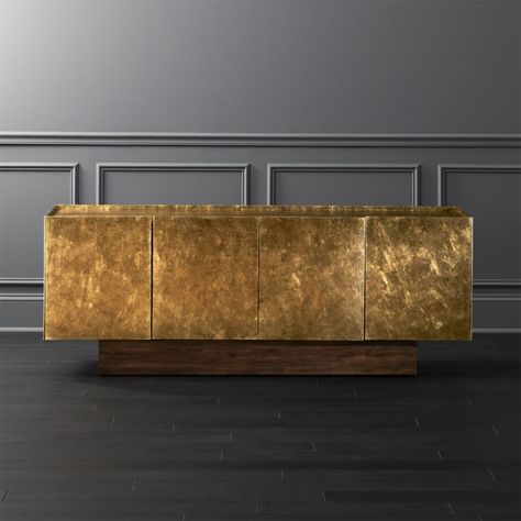 Shop Kinzie Wood Credenza. Bronze and gold textured brush strokes mosh across four doors of this handpainted mindi wood credenza. Designed by Mermelada Estudio, the faux-metal sheen brings edge to the piece, rock-solid on a wood plinth base. Learn more about on our blog. CB2 exclusive. Modern Storage Furniture, Glam Dining, Wood Media Console, Diy Buch, Teak Credenza, Wood Credenza, Living Room Tv Wall, Modern Credenza, Modern Storage