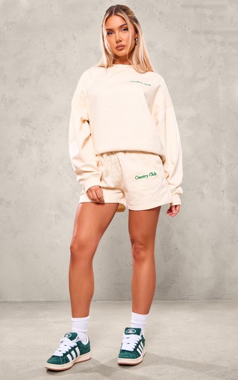 PRETTYLITTLETHING Cream Embroidered Country Club Washed Sweat Shorts - Swag Outfits - Take those chilled days on in style with these PrettyLittleThing cream embroidered country club washed sweat shorts. Brought to you in a cream hue washed sweat material with an embroidered 'Country Club' design and a seriously comfy fit, how can you resist? Team these cream shorts with the matching Sweatshirt and sneakers for an off-duty look we're loving.,   #swagoutfits #women'sfashion Sweatsuit Shorts Outfit, Matching Set Outfit Shorts, Country Club Design, Off Duty Outfits, Denim Hoodie, Wide Fit Boots, Matching Sets Outfit, Cream Shorts, Matching Sweatshirts