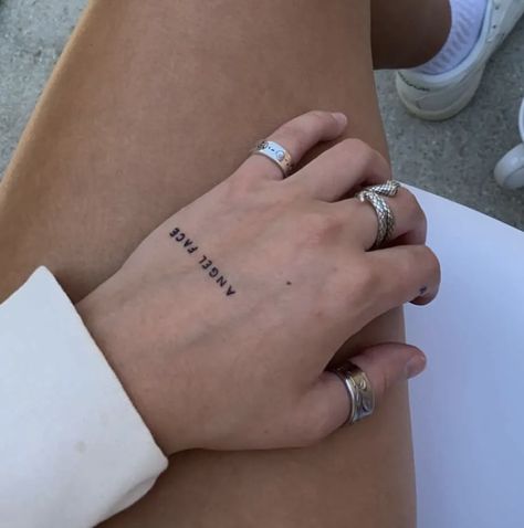 Phrase Hand Tattoo, Hand Words Tattoo, Hand Text Tattoo, Angel Tattoo Hand, Angel Writing Tattoo, Word Angel Tattoo, Hand Tattoo Writing, Hand Tattoo Name, Writing On Hand Tattoo
