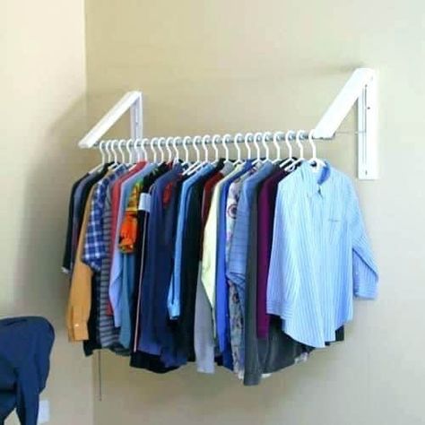 Do you get frustrated at the clutter and lack of space in your small bedroom and closet? Are you trying to downsize or move to a more minimalist lifes... | Use Hanging Brackets to Put Up Clothes #smallbedroom #bedroom #bedroomorganization Clothes Storage Solutions, Clothes Storage Systems, Small Closet Storage, Clothes Hanger Storage, Closet Clothes Storage, Small Laundry Room Makeover, Small Bedroom Organization, Storage Solutions Closet, Small Laundry Room Organization