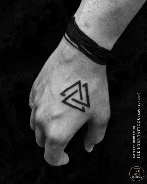 The Valknut: History, Symbolism, and Meaning - Psycho Tats The Fates Tattoos Simple, Valknut Tattoo Meaning, Hungarian Tattoo Ideas For Men, Runes Language, Runic Tattoo Ideas, Dark Small Tattoos, Viking Symbols Tattoo, Valknut Tattoo Design, Valknut Meaning