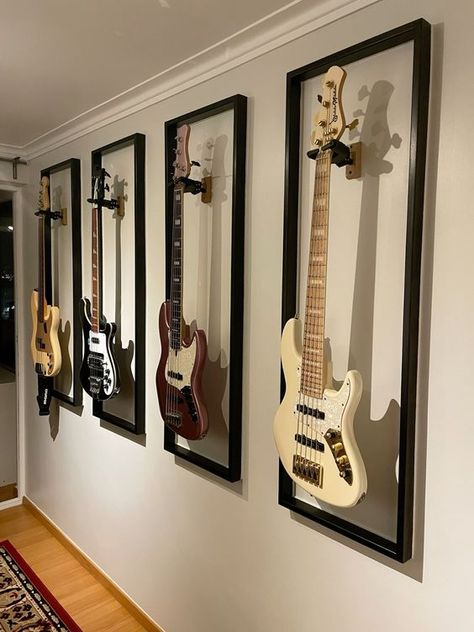 bass guitar Office With Guitars, Bass Guitar Decoration, Wall With Guitars, Living Room Guitar Display, Decorating With Guitars Living Rooms, Guitar As Decor, Guitar Room Setup, Office Guitar Room, Living Room With Guitars On Wall