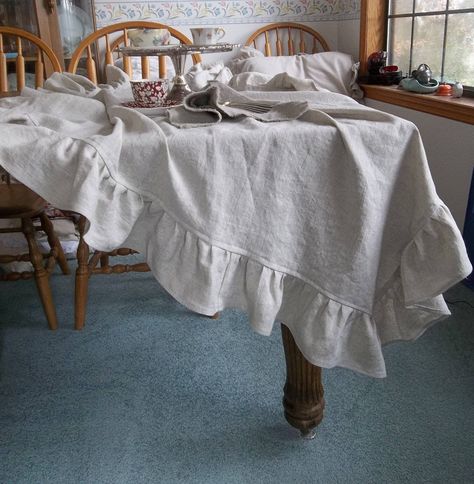 "Ruffled Linen Table Throw in Custom Sizes and Fabrics - please select from the drop down Ruffled Table Scarf is perfect tossed over the end of your table for a casual cottage style or Farmhouse look.  Table Throw may be used as a tablecloth on a Small table. Table throw shown is Oatmeal Linen.   NOTE--Measurements in the drop down are the actual size of the table throw (ruffles included in the measurement).  For example--a 48\" x 48\" table throw will fit a 30\" table with a 9\" drop on the sid Tela, French Farmhouse Kitchen Cottage Style, Drop Cloth Tablecloth, French Country Porch, 48 Table, Farmhouse Style Chairs, Dining Farmhouse, Ruffled Tablecloth, Table Scarf