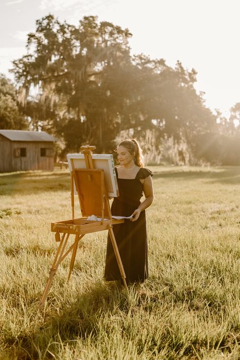 In addition to providing exceptional entertainment for your family and friends, Live Wedding Painting allows for your special day to be captured in unique way—through a heirloom that can be passed down from generation to generation. Photo by: Grace Jicha Photography / www.gracejicha.com South Florida wedding / Rustic wedding / Orlando wedding / Golden hour inspo / Artist photoshoot / Field photoshoot / Bella Collina / Southern weddings / Baker's Ranch / Luxery wedding inspo / Florida bride / Artist Photoshoot Outdoor, Outdoor Artist Photoshoot, Photoshoot For Artist, Photography Concepts Ideas, Artist Photoshoot Ideas Art, Painting In A Field, Painting Photography Ideas, Painting Photoshoot Ideas, Artist Photoshoot Ideas