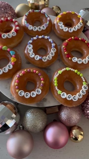 Brookie Cookie on Instagram: "How fun are these friendship bracelet donuts!?! Would be adorable for a Taylor Swift party!! By @created.at.home 🍩 🤍❤️ #erastour #erastourmovie #taylorswift #donuts #krispykreme #taylornation #friendshipbracelet #taylorswiftlyrics #foodies #foodcreator #taylorswiftconcert #swiftie #karma #taylorsversion" Super Bowl Donut Ideas, Taylor Swift Superbowl Snacks, Taylor Swift Football Cookies, Taylor Swift Superbowl Party Food, Taylor Swift Birthday Ideas 15, Swiftie Superbowl Party, Taylor Swift Donut Ideas, Taylor Swift Super Bowl Snacks, Taylor Swift 21st Birthday Party