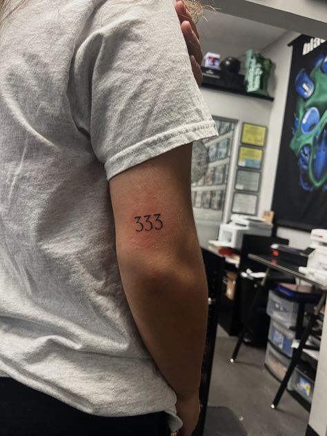 333 Tattoo Placement Ideas, Angel Number Tattoo Back Of Arm, 333 Vertical Tattoo, 333 Fine Line Tattoo, Angel Number Tattoos 333, 333 Number Tattoo, Small 333 Tattoo, 333 Old English Tattoo, 333 Angel Number Tattoo Ideas Fonts