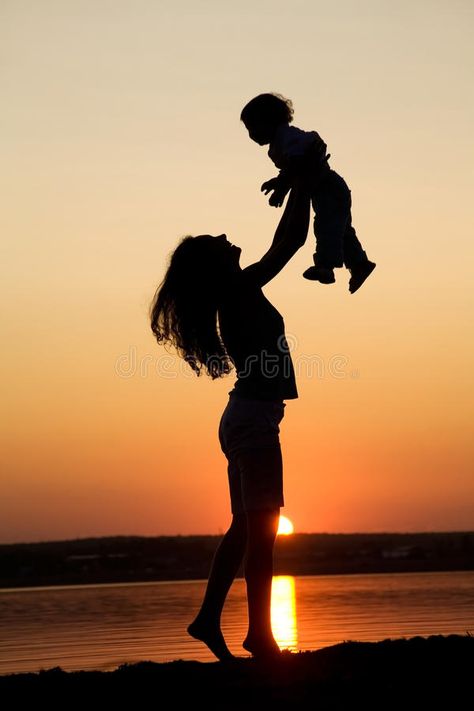 Photo about Silhouette of mother which turns the child against a sunset and water. Image of night, parents, evening - 11704254 Mother And Child Pictures, Mother Daughter Art, God Tattoo, Mother Daughter Photos, Mother Photos, Mother Pictures, Mother Images, Silhouette Photography