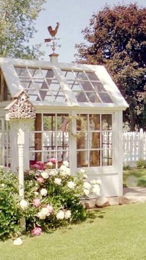 This is the most adorable greenhouse and she shed I have every seen! This is the perfect cottage garden with the white picket fence in the background. Serre Diy, Decorating Garden, Window Greenhouse, Shed Landscaping, Greenhouse Shed, Backyard Greenhouse, Greenhouse Plans, Backyard Sheds, Backyard Shed