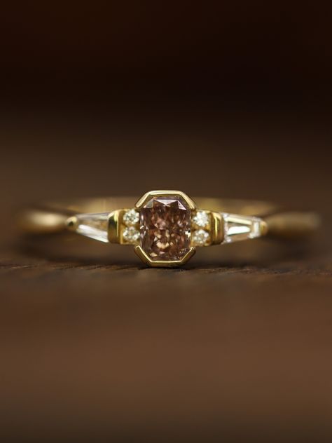 Looking for a unique touch for your engagement ring? 🤎 Brown diamonds have a distinctive beauty, giving them a special allure if you're looking for an alternative engagement ring. 🤎 Rich brown stones, also known as cognac diamonds, boast a warm, earthy hue that sets them apart from traditional white diamonds. Their deep tones exude elegance and sophistication - and can be super flattering. This one of a kind deco inspired ring features brown and white diamonds and is currently available a... Brown Stone Engagement Ring, Brown Engagement Ring, Non Traditional Engagement Rings, Brown Engagement Rings, Brown Diamond Ring, Engagement Rin, Brown Diamonds, Cognac Diamonds, Cute Engagement Rings