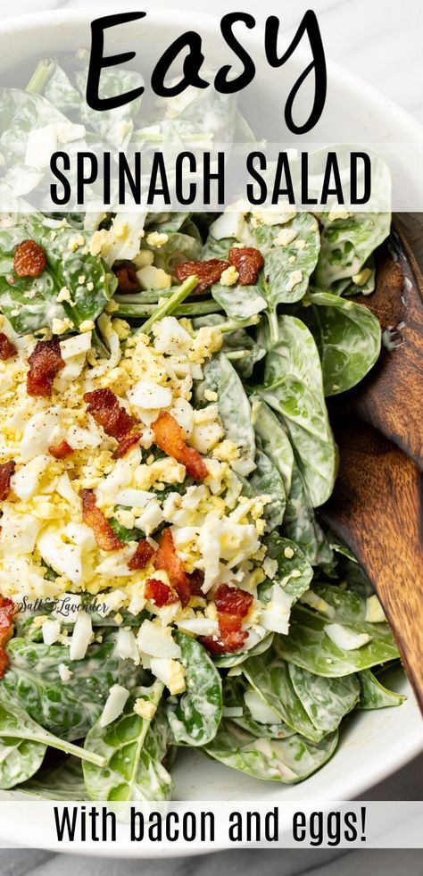 a bowl of salad with serving spoons and text overlay that reads easy spinach salad - with bacon and eggs! Spinach Salad Recipes Dressing, Spinach Salad Recipes Easy, Spinach Salad With Bacon, Spinach Salad Dressing, Creamy Garlic Dressing, Egg Spinach, Bacon Spinach Salad, Garlic Dressing, Salad With Bacon