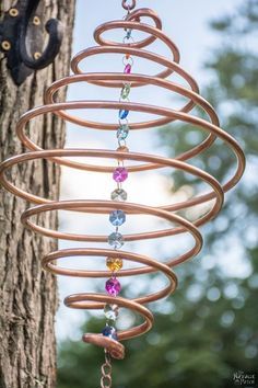 How to Make Coiled Copper Wind Chimes                                                                                                                                                                                 More Wind Chimes Diy, Copper Wind Chimes, Copper Wind Spinners, Chimes Diy, Carillons Diy, Copper Wire Crafts, Diy Copper, Upcycle Garden, Copper Decor