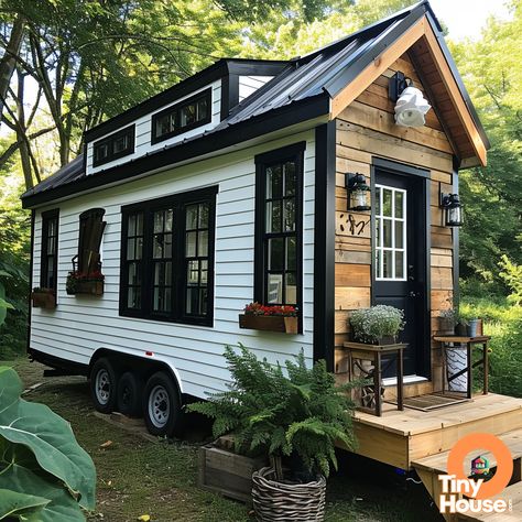 Check out this adorable tiny house on wheels! It's inspired by Cape Cod design, with its charming white exterior, black accents, and natural wood elements. What's your favorite design element? Would you incorporate any of these into your own home? #TinyHouse #CapeCodStyle #TinyLiving #DesignInspo Tiny House Trailer Exterior, Florida Tiny House, Black And White Camper Exterior, Black And White Tiny House, Tiny Home Wheels, Nice Trailer Homes, Tiny Cabin On Wheels, Tony House On Wheels, Tiny Homes On Trailers
