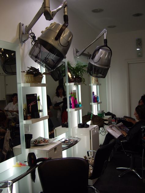 Inside salon. Rome, Italy Dryers mounted on wall at each station. Salon Dryer Station Ideas, Salon Wall Hair Dryers, Wall Mounted Hair Dryer Salons, Floating Salon Stations, At Home Salon Station, Salon Dryer Area Ideas, Hair Dryer Salon, Hair Dryer Wall, Beauty Shop Decor