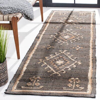 This area rug has a natural color palette and looks that ground your space. It's handmade from 100% jute in a flatweave technique, with a cotton backing. The design features ivory and gray geometric shapes in a rustic, Southwestern style. We love this area rug's 0.16'' pile height makes it easy to vacuum and keep clean, even in an outdoor setting. We recommend pairing it with a rug pad to keep it in place underfoot sold separately. Rug Size: Runner 2'3" x 9' | Black / White 108 x 27 x 0.16 in Ar Living Room Jute Rug Decor, Black And Whote Rug, Natural Runner Rug, Jute Rug Runner Kitchen, Front Door Rug Indoor, Basement Rugs Concrete Floors, Southwestern Area Rug, Southwestern Runner Rug, Dark Rugs In Bedroom