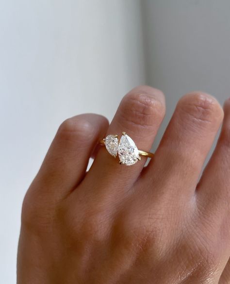 This ring goes viral every time we post it🤍 This gorgeous Toi et Moi engagement ring features two pear-cut stones side by side, with a… | Instagram 2 Stone Pear Engagement Ring, Wedding Ring Two Stone, 2 Diamond Wedding Ring, Wedding Ring Two Stones, Two Stone Pear Engagement Ring, Simple Rings Engagement Unique, Wedding Rings Toi Et Moi, Wedding Ring 2 Stones, Toi Et Moi Pear Ring