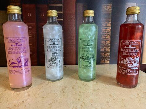 Our most popular and magical product! Get all 4 of our potions including Serpents Venom (Lemonade), Basilisk Blood (Mixed Fruits), Tears of A Wizard (Cream Soda), and Unicorn Essence (Fruit Twist).They come in 250ml bottles and the potions come to life with a magical shimmer when you use the potion spell.The potions are all sugar free and mix well with poisons such as gin, vodka and rum. Drinkable Potions, Magical Drinks, Shambles York, Sugar Free Drinks, Carbonated Water, Drinks Design, Flavored Drinks, Pretty Drinks, Cream Soda