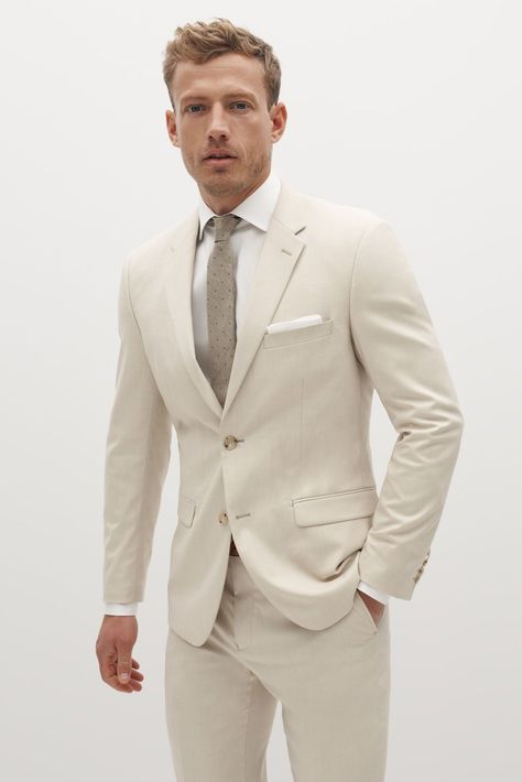 Play into the neutral-hued trend with this light tan suit, which feels especially perfect for early fall nuptials. It’s made of a stretchy fabric meant to keep you comfortable for hours, and the light color is sure to pair well with almost any wedding-day color palette. Light Tan Suit, Tan Groomsmen, Tan Suit Jacket, Cream Suit, Suit Man, Tan Suit, Blazer Men, Tan Dress, Tan Blazer