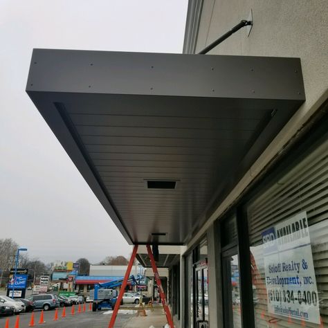 MASA Extrudeck canopy with lights at Grant Plaza in Philadelphia, PA. #architecture #design #metal #manufacturing #Americanmade Black Metal Awnings On House, Canopy Design Outdoor House, Canopy Design Entrance, Entrance Canopy Design, Front Door Awning Ideas, Canopy With Lights, Terraced House Extension, Aluminum Awning, Metal Awnings