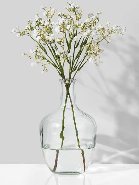 Simple yet beautiful clear glass vase; great for long stemmed floral arrangements. Measures 10" tall. Beautiful with eucalyptus, hydrangeas, olive branches or give it a coastal vibe with large frawns. Stunning centerpiece for a coffee table, dining table or large kitchen island. #affiliate Anthropologie Diy, String Lights Inside, Glass Bottle Vase, Glass Vase Decor, Dame Jeanne, Coffee Table Centerpieces, Olive Branches, Garden Vases, Glass Bottles With Corks