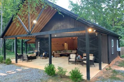 Metal Building With Carport, Pole Barn Garage Interior, Pole Barn Colors Scheme, Modern Barn House Interior Design, Party Barn Interior, Black Cabins, Barn Shop Ideas, Barn Gym, Barn Pool House