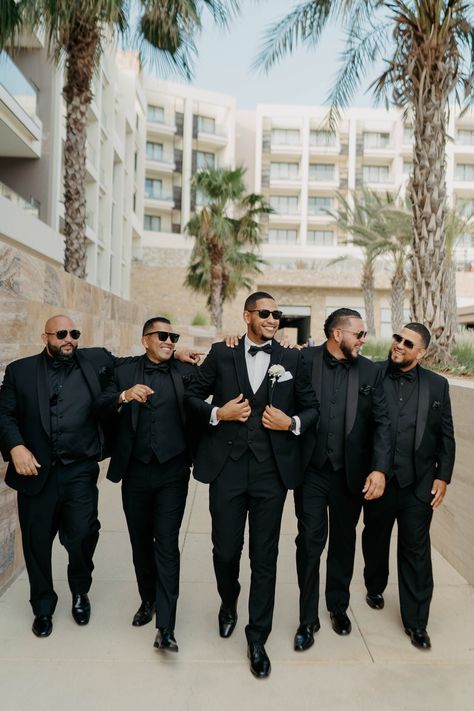 groom and groomsmen attire | groomsmen photos | groomsmen outfit ideas | Los Cabos wedding | destination wedding photographer | resort wedding in cabo Groom In Bow Tie And Groomsmen In Ties, All Black Wedding Groomsmen, All Black Groomsmen Attire Cowboy, Groomsmen All Black Attire No Jacket, Groomsman Tux Ideas, Grooms All Black Suit, Black White And Green Groomsmen, Groomsmen Attire All Black Suit, Summer Wedding Groom Attire Black