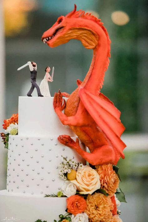 Orange dragon fantasy wedding cake with peach and orange flowers at Chihuly Glass House | Flora Nova Design Seattle Lotr Cake Wedding, Diy Fantasy Wedding Decorations, Fantasy Wedding Cake Topper, Wedding Cake Designs Colorful, Orange And Green Wedding Cake, Dragon Wedding Cake Topper, Dragon Theme Wedding, Alternative Wedding Cake Ideas Unique, D&d Wedding Cake