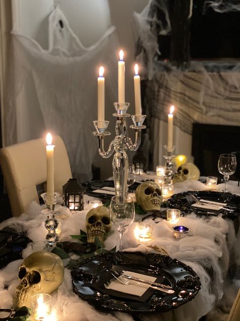 Halloween party table set up. 4 skulls are required for a fuller look. Linked below. Table Decorations Halloween Party, Halloween Party Kitchen Decor, Halloween Party Ideas 2023, Halloween Party Decor Classy, Haunted Hotel Halloween Party, Halloween Party Classy, Goth Birthday Theme, All Black Halloween Party, Gothic Themed Birthday Party