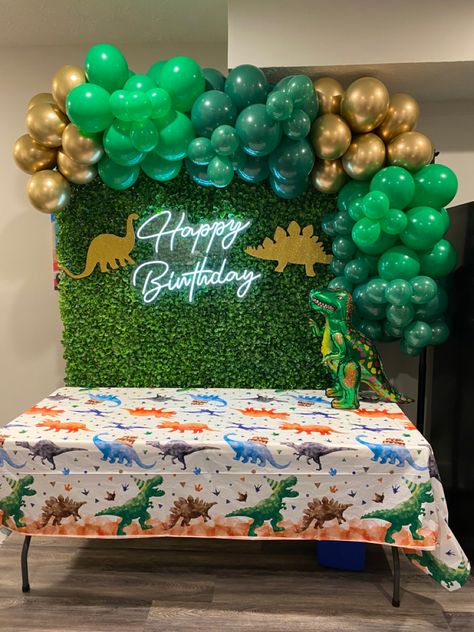 #dinosaurbirthdayparty #dinoparty #dinobirthday #dinosaurparty #dinosaurparty #dino #dinosaur #dinosaurdecorations #dinosaurpartydecorations #greenerywall #balloongarland #dinosaurballoon #happybirthdayneonsign #neonsign #birthdaybackdrop #kidsbirthdayparty #kidsbirthday #tworex #threerex #fourrex #fiverex #gold #green Dino Backdrop Birthday Party Ideas, Dinosaur Themed Birthday Party Backdrop, Dinosaur Backdrop Ideas, Dino Backdrop, Dinosaur Birthday Backdrop, Dino Party Decorations, Dinosaur Party Decorations, Dinosaur Birthday Party Decorations, Dinosaur Balloons