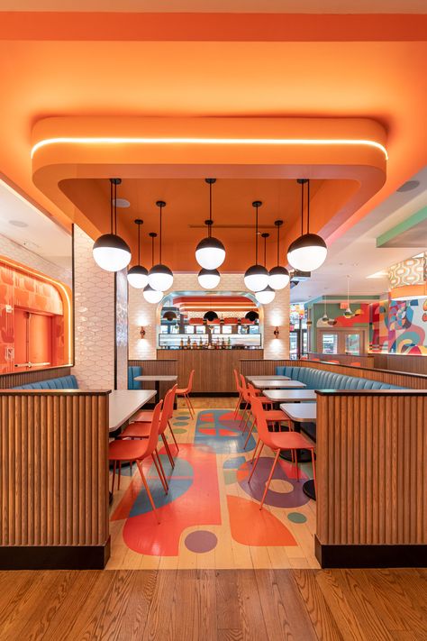 Orange Interior Restaurant, Restaurant Design Colorful, Fun Restaurant Interior, Pop Restaurant Design, Restaurant Interior Design Colorful, Resturent Idea Interior, Yellow Restaurant Interior Design, Modern Retro Restaurant, Cafe Design Colorful