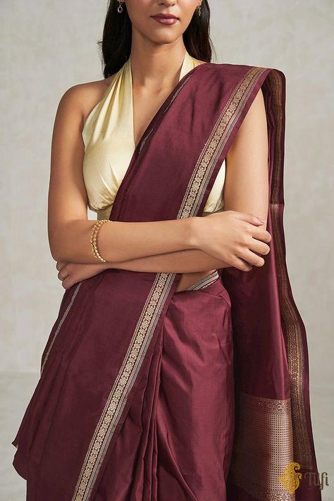 "\nPreshti\nSimple yet classic. An elegantly woven satin silk saree that is perfect for any occasion.\u00a0A mesmerising silken weave with a beautiful and unfussy Kadhua border and aanchal.\n\u00a0\n\n\nColor\u00a0-\u00a0A\u00a0stunning\u00a0shade of\u00a0Maroon\n\nTechnique\u00a0-\u00a0An enduring Kadwa weave. The elaborate and laborious Kadwa (Kadhua) technique involves hand-weaving each motif separately. It takes longer on the handloom, but makes a more robust pattern, which stands out on the fabric.\n\nFabric\u00a0- Soft as butter, pure\u00a0Satin Silk\n\nSpeciality\u00a0-\u00a0A\u00a0gorgeous plain\u00a0satin silk body woven in the finest kadhua style\u00a0with an unfussy border and floral paisley pallu. An absolutely elegant and understated Banarasi weave.\n\n\nTilfi Promise\u00a0- P Pastel Colour Saree, Aesthetic Kurti, Saree Onam, Sarees Casual, Saree Outfits, Banarasi Sari, Fashion Infographic, Satin Silk Saree, Formal Saree