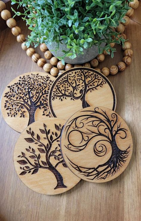 Tree of Life Wood Coasters set of four Individual Designs #woodslicemagic #diyhomedecor #sustainablecrafts #naturalart #woodslicedecor #diygiftideas #Woodworking #WoodworkingTips #WoodworkingProjects #WoodworkingIdeas #WoodCraft #WoodArt #DIYWoodworking #WoodworkingCommunity #HandmadeWoodwork #WoodworkingSkills #WoodworkingLife #WoodworkingInspiration #WoodworkingCrafts #WoodworkingDesign #DIYWoodGingerbreadHouses Laser Cut Wood Coasters, Compass Wood Burning, Wood Burning Ideas For Beginners Simple, Wood Burned Coasters, Wood Burning Ideas, Wood Etching, Beginner Wood Burning, Wood Slice Decor, Pyrography Designs