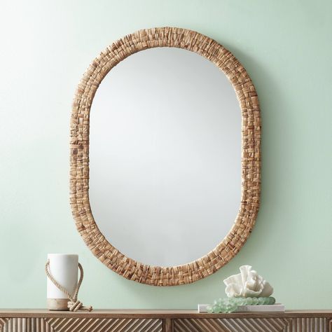 PRICES MAY VARY. 26 1/2" wide x 36" high x 1 1/4" deep. Hang weight is 13.64 lbs. Glass only section is 21" wide x 30 1/2" high. Modern coastal oval wall mirror by Noble Park. Can be installed vertically or horizontally. D-ring hangers on the back. Natural finish. Woven rattan construction. Beveled glass. For indoor use only. Brighten a hall or bedroom with the reflectivity of this coastal oval wall mirror. Rich in texture and dimension, it boasts a frame wrapped in natural rattan for a beachy v Coastal Mirrors, Boho Mirror, Coastal Style Decorating, Mirror Modern, Wicker Mirror, Entryway Mirror, Vanity Wall Mirror, Rattan Mirror, Mirror Lamp