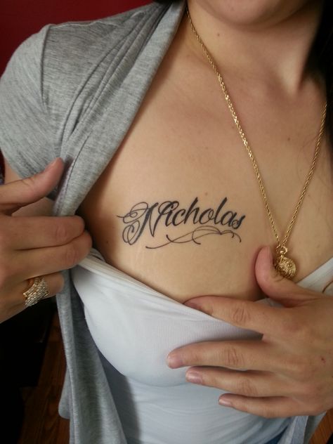 Chest Name Tattoos For Women, Name Tattoo Chest Women, Significant Other Name Tattoo, Tatto Names Idea, Isaiah Tattoo Name, Boyfriend Name Tattoos For Women Chest, Cursive Chest Tattoo, Name On Chest Tattoo Female, Name Tattoos Chest