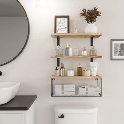 Our bathroom floating shelves with basket are made of Pinewood which grows naturally, so each piece of the board has unique natural wood grain and colour. Through the simplest charcoal roasting process, we restore the carbonized colour and texture of the wood itself. Our bathroom floating shelves make full use of the wall, and let your room and bathroom look so cute.The size of the floating shelves basket is 16.5x6x5.5 inches, which can store 3 rolls of toilet paper, other small objects, and tow Small Bathroom Storage Above Toilet, Open Shelves In Bathroom Above Toilet, Bathroom Organizer Over Toilet, Minimalist Bathroom Shelves, Floating Shelves Bathroom Storage, Above Toilet Shelving, Over Toilet Towel Storage, Bathroom Shelves Over Toilet Decor Ideas, Bathroom Wall Shelves Above Toilet