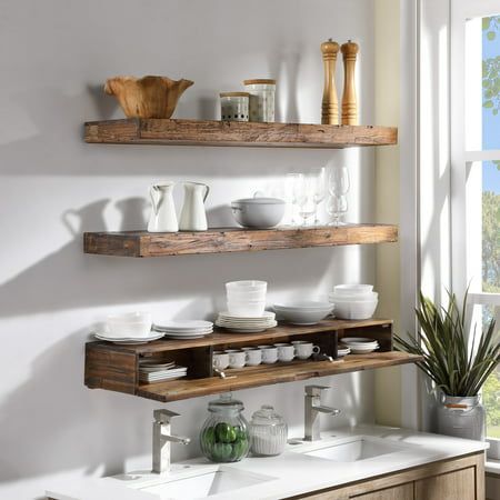 Stylize your kitchen with these decorative but functional floating wall shelf. Deep enough to showcase ceramic ware, the thick distressed wood design makes this piece both visually substantial and structurally rigid. A concealed internal compartment can store teas, tools, and more. Installation is very easy, and includes a french cleat. Made from quality Acacia hardwood, this unit will make a great highlight piece for your kitchen. Color: Brown. Dark Floating Shelves Kitchen, Bathroom Rustic Shelves, Distressed Wood Floating Shelves, Kitchen Sink Open Shelving, Floating Shelves Over Bathtub, Floating Wooden Shelves Kitchen, Solid Wood Shelf, Floating Butcher Block Shelves, Floating Shelves For Dishes