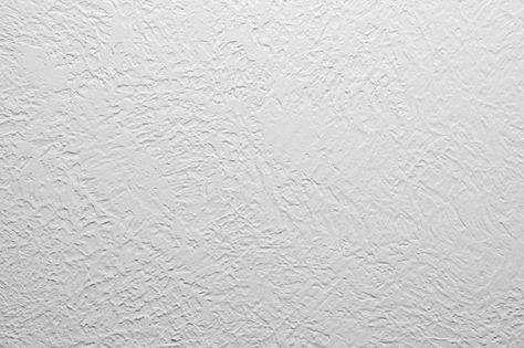 There are 7 types of textured wall ideas you can try for your own house. Learn about these styles and how to create textured walls yourself. | 7 Types of Wall Texture and the Techniques Behind Them Types Of Wall Finishes, Spanish Lace Walls Texture, Sheetrock Texture Styles, How To Texture Wall, Types Of Wall Texture Interiors, Different Types Of Wall Texture, Light Textured Walls, Drywall Texture Types Of, How To Create Textured Walls