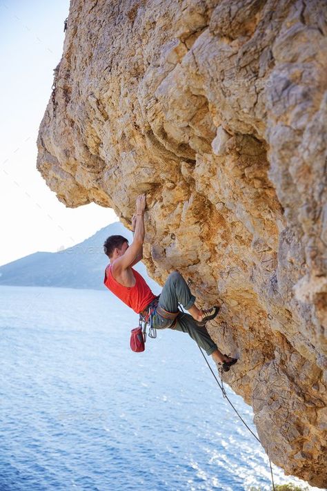 Young man lead climbing on overhanging cliff by photobac. Young man lead climbing on overhanging cliff over water #Affiliate #lead, #climbing, #Young, #man Rock Climbing Workout Beginner, Rock Climbing Aesthetic, Rock Climbing Photography, Kids Rock Climbing, Rock Climbing Outfit, Climbing Wall Kids, Rock Climbing Workout, Lead Climbing, Rock Climbing Gym