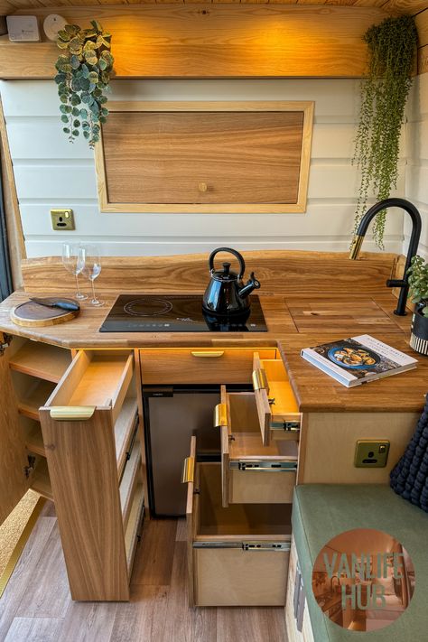 Beautifully executed with so much campervan storage for for a kitchen. Also love that hatch which allows access through to the cab.  In the full tour, there's even more storage beneath the clever longitudinal bed, plus full-height storage cupboard. Campervan Kitchen Storage, Medium Wheel Base Van Conversion, Van Bookshelf, Vw Crafter Camper Conversion, Van Lighting, Caravan Storage Ideas, Tiny Kitchen Storage, Van Life Storage, Crafter Campervan