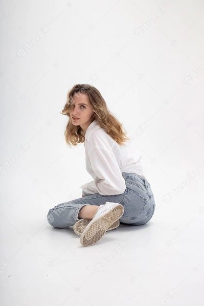 Premium Photo | Young attractive caucasian blond woman posing in shirt and blue jeans, sitting on white studio floor Sitting Poses Drawing Back View, Croquis, Woman Pose Reference Sitting, Floor Sitting Reference, Sitting Poses Knees Up, Sitting In Jeans Reference, Sitting Looking Back Pose, Sitting Poses Low Angle, Women Sitting Poses Drawing Reference