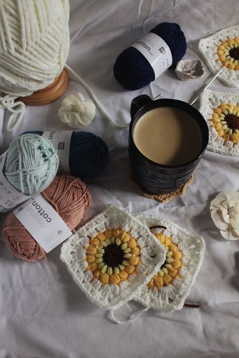 aesthetic photo of crochet granny squares, pink, blue, and white yarn, white flowers, and a cup of coffee on a white sheet. Crochet Products Photography, Crochet Vibes Aesthetic, Crotecht Aesthetic, Crochet Mood Board, Crochet Asthetic Picture, Crochet Lifestyle, Aesthetic Crochet Projects, Crocheting Aesthetic, Business Core