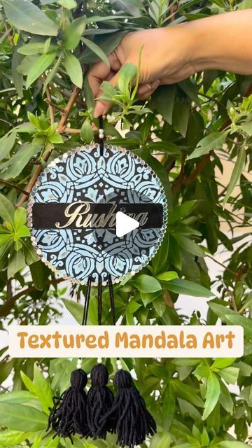 Meenakshi Meena 🇮🇳👩‍🎨 on Instagram: "Textured Mandala Art nameplate with Tassels ☺️

Size 6” and with tassels 12” can be customized in size and colour 

Created for my client’s daughter Rushina

DM to place your orders and queries

Only online payments accepted, no COD

ORIGINAL ARTWORK
DO NOT COPY ❌

Bulk order is accepted 

[textured, textured art, textured art work, textured mandala, mandala art, stencil art, textured name plate, bulk order, Customized order, customized gifts,
customized nameplate, Customized return
gifts, wedding gifts, valentine gifts, textured fusion art, original art, kids room decor item, kids room decore idea, 
anniversary gifts, return gifts ideas, eco pant logo,
brand logo, Lippan art, Lippan artwork, Lippan kaam,
Kutch, fusion artwork, wall decor, wall deco Room Decore Idea, Lippan Artwork, Return Gifts Ideas, Return Gifts Wedding, Lippan Kaam, Decore Idea, Lippan Art, Fusion Art, Return Gifts