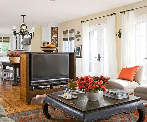 I like the idea of separating the LR and DR with a TV cabinet. This antique cabinet is used as a shelf, a media center, and a room divider.  Even though the cabinet is in the middle of the room, because it doesn't stretch to the ceiling, the zones still feel like one space. Family Rooms, Family Friendly Living Room, Furniture Placement Living Room, Tv Furniture, Furniture Placement, Open Living Room, Trendy Living Rooms, Family Room Design, Family Living Rooms