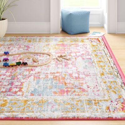 This octagonal area rug is a lovely foundation for your living space. It’s power-loomed from stain-and fade-resistant polypropylene and features a floral design in earthy rose, blue, and yellow hues. The 0.33” pile height makes this rug feel soft and cushiony underfoot, so it’s a great choice for places where you like to relax and feel comfortable - think your den or bedroom. To care for it, spot clean with water and mild detergent. We recommend rolling it out over a pad to prevent shifting. Rug Orange And Pink Rugs, Bedroom Rug Boho, Pastel Area Rug, Rug Bedroom Ideas, Pink And Yellow Bedroom, Pink Bedroom Rug, Light Rugs, Dorm Room Rug, Boho Area Rugs